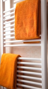 Modern contemporary bathroom radiator combining central heating and drying facilities